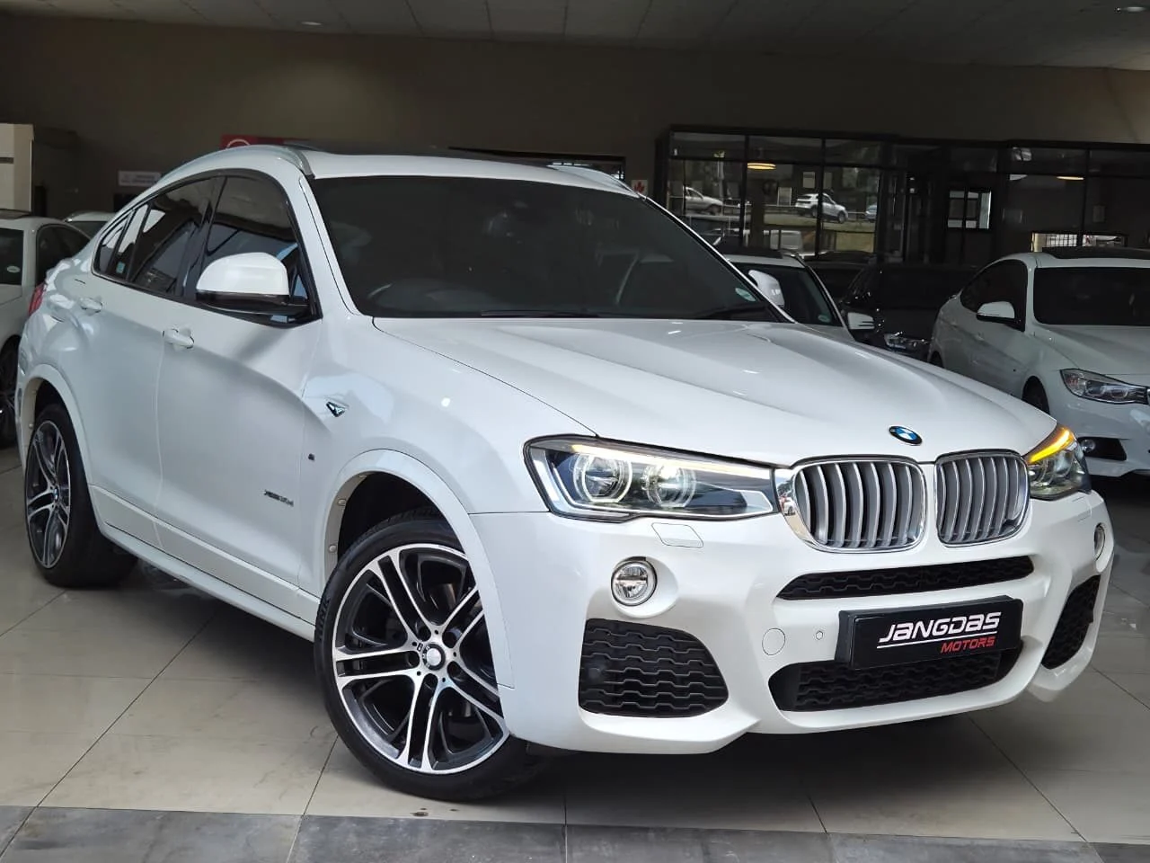 2017 BMW BMW X4 xDrive30d M Sport, front three-quarter